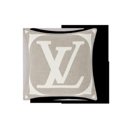 a white and grey pillow with the letter v on it's front side,