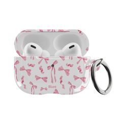 an apple airpods case with pink bows on the front and side, attached to it