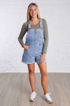 Get ready for a playful weekend with our Ramona Overalls. These cuffed denim overall shorts are in a light wash denim color and are perfect for a casual look. With adjustable straps and multiple pockets, these overalls have both style and functionality. They feature five pockets on the front and two on the back, button closures on each side, belts loops, and adjustable and removable straps. Don't miss out on these fun and versatile overalls! They are lightweight and fit true to size. 100% Cotton Casual Light Wash Shortalls For Summer, Casual Light Wash Summer Shortalls, Blue Utility Shortalls For Spring, Washed Denim Shortalls, Spring Cotton Shortalls In Medium Wash, Spring Medium Wash Cotton Shortalls, Relaxed Fit Denim Shortalls In Medium Wash, Light Wash Shortalls With Pockets And Relaxed Fit, Medium Wash Denim Shortalls In Relaxed Fit