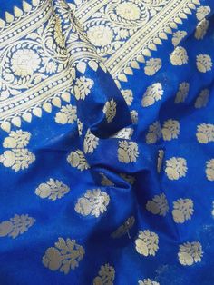 Dupatta length: 2.40 m Dupatta width: 0.9 m Blended Dry clean This dupatta is made of finely woven fabric and is decorated with intricate design and engravings Banarasi dupattas are characterised by brocade borders & pallus. They often have woven buti or jall on the body Luxury Blue Tussar Silk Dupatta, Blue Tussar Silk Dupatta With Pallu, Anarkali Style Art Silk Shawl For Diwali, Anarkali Art Silk Shawl For Diwali, Diwali Anarkali Shawl In Art Silk, Blue Raw Silk Dupatta With Pallu, Gold Unstitched Jamawar Suit With Traditional Drape, Blue Katan Silk Dupatta For Wedding, Gold Jamawar Unstitched Suit With Traditional Drape