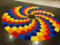 a multicolored circular design on the floor