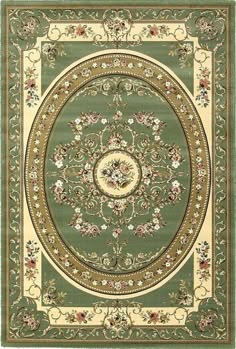 a green rug with gold trimmings and floral designs on the center, in an oval