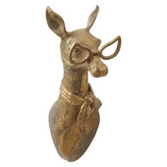 a brass deer head with glasses on it's face is shown in front of a white background