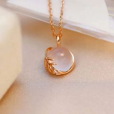 ✦ Looking for a unique and stylish piece of jewelry? Look no further than this Pink Pendant Necklace featuring a natural Rose Quartz stone and delicate Leaf Design. The necklace is crafted from high-quality 925 silver with a gold vermeil finish, which gives it a luxurious look and feel. The Leaf Design pendant is inspired by nature, and the natural pink Rose Quartz stone adds a touch of femininity to the piece. The pendant is suspended from a delicate chain that is adjustable, so you can wear it Rose Gold Plated Round Jewelry, Rose Gold Gemstone Jewelry For Her, Rose Gold Gemstone Jewelry As A Gift For Her, Elegant Flower Pendant Necklaces With Natural Stones, Exquisite Gemstone Flower Pendant Necklace, Rose Gold Plated Round Necklace, Feminine Sterling Silver Choker Necklace, Feminine Sterling Silver Necklace With Clavicle Chain, Feminine Sterling Silver Clavicle Chain Necklace