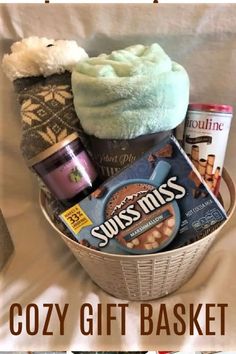 the cozy gift basket is filled with various items