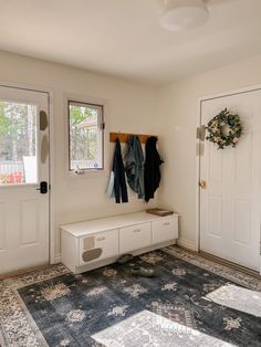 the entryway is clean and ready for us to use as a coat rack or bench