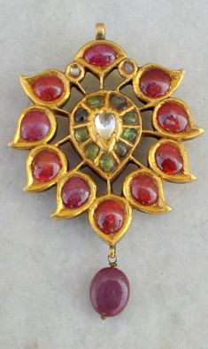 20KT VINTAGE ANTIQUE TRIBAL OLD GOLD PENDANT NECKLACE FROM RAJASTHAN INDIA, GREAT HANDMADE DESIGN SETED RUBY, EMERALD, POLKI GEMSTONES, GOOD FOR JEWELLERY COLLECTION. Note - There is wax in the pendant. Weight - 30.6 grams Height include dangle - 6 cm(2.36") Width max. - 4 cm(1.57") Material - 20kt yellow gold & original old piece. Antique Gold Pendant, Jewelry Knowledge, Tiaras Jewellery, Necklace Ruby, Gold Nose Stud, Traditional Indian Jewellery, Antique Jewellery Designs, Handmade Gold Jewellery, Antique Jewelry Indian