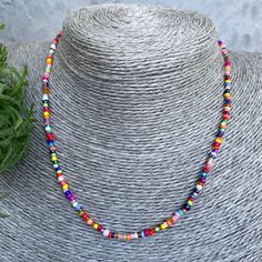 Buy a necklace handmade from beads. 🌟It is handcrafted on double thick line for durability and strength. 🌟The clasp is a carabiner clasp. 🌟The beads are tiny, each necklace is unique in its own way. It is possible to choose the length. 🎁 As a gift you get a storage bag :) Adjustable Rainbow Beaded Necklace, Colorful Letter Beads For Festival, Colorful Heishi Beads Choker Necklace, Colorful Heishi Letter Beads, Colorful Adjustable Beaded Necklaces With Large Beads, Colorful Beaded Necklaces With Spacer Beads For Festival, Multicolor Heishi Bead Choker, Colorful Beaded Necklaces With Letter Beads For Jewelry Making, Multicolor Letter Beads Choker With Round Beads