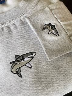 Embroidered 'Shark' Sweatshirt with matching embroidery on the left cuff! Our Sweatshirts are made of 50% Cotton and 50% Polyester - 300gsm Multiple sizes available from XS to XXXL Please check the size guide and thread colour choices are in the photos for you! Hoodies Shark, Shark Gift Ideas, Embroidery Shark, Shark Clothes, Shark Embroidery, Shark Sweater, Comfy Christmas, Shark Sweatshirt, Shark Stuff