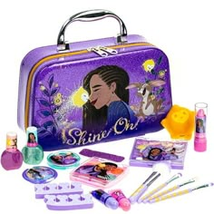 an image of a purple bag with makeup and other items in it on a white background