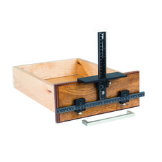 a wooden box with a ruler in it and two pieces of wood on the bottom