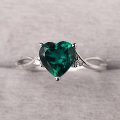 ◆ The ring is handcrafted from sterling silver and decorated with a dazzling 8*8 mm emerald and CZs. It is suitable for engagement/anniversary/daily occasion. ◆ Production Description: Main stone Type: Lab Emerald Main Stone Shape: Heart Cut Main Stone Size: 8*8 mm(1.59ct) Side stone: CZ Metal: 925 Sterling silver - Other options available in the drop down menu ◆ Customization: √Free for Add Engraving √Other Metal Type Available √Other Gemstones & Shapes Available √Personalization Requests Avail Green Fine Jewelry Heart Ring For Wedding, Green Heart Cut Rings For Wedding, Green Heart Cut Wedding Rings, Sterling Silver Emerald Ring With Accent Stones For Promise, Heart-shaped Emerald Rings For Wedding, Emerald Promise Ring With Accent Stones In Sterling Silver, Green Diamond Heart Cut Ring, Elegant Heart Ring With May Birthstone Gemstone, Heart Cut Diamond Emerald Ring For Wedding