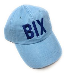 Show your Biloxi love with this custom made BIX airport code style baseball hat. Baby Blue pigment dyed baseball hat with Navy thread. Our airport code hats are a fun and stylish way to represent your hometown, favorite vacation destination or someplace you've always wanted to visit. Our quality hats feature the 3 letter airport code assigned to the coordinating city. We can do any airport code, so if you're looking for one that isn't listed, just order a custom airport code hat and let us know Trendy Blue Baseball Cap With Embroidered Logo, Spring Blue Baseball Cap With Embroidered Logo, Blue Baseball Cap With Letter Print, Blue Embroidered Visor Baseball Cap, Blue Embroidered Baseball Cap, Blue Pigment, Quality Hats, Baby Hats, Baby Blue