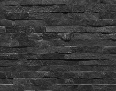 a black and white photo of a brick wall