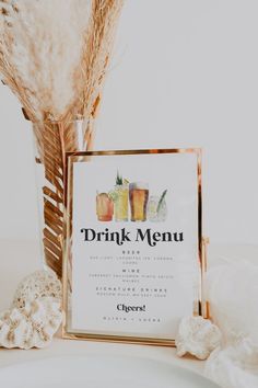 a drink menu sitting on top of a white plate