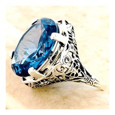 Vintage Estate 10 Carat London Blue Simulated Topaz Solitaire Filigree Ring. 925 Solid Sterling Silver. Stamped 925.  Excellent Condition/Like New. Ring Sizes 5-10 Filigree Ring, Blue Band, Solitaire Rings, Ring Sizes, London Blue Topaz, London Blue, Solitaire Ring, Lovely Gift, Blue Topaz