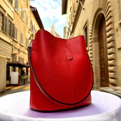 This bag has been made of the best genuine leather by local master crafters of Florence in Italy, designed for women who only accept premium Italian quality and luxury leather bags and modern Italian fashion. . Size: Width: 27 cm / 10.75 inches Height: 19 cm / 7.50 inches Depth: 9 cm / 3.50 inches Color: Red . The story of this bag : In the heart of Italy, where the art of leather craftsmanship thrives, a team of dedicated artisans creates masterpieces that transcend time and fashion. Among their creations is a breathtaking piece that stands as a symbol of beauty, quality, and elegance - the Italian Red Leather Tote. Handcrafted with meticulous precision and passion, this exquisite red tote is a prime example of Italian excellence. It embodies the essence of classic design, boasting a time Art Du Cuir, Classic Leather Bag, Luxury Leather Bag, Handmade Leather Bags, Italian Leather Bags, Red Tote, Red Bag, Red Handbag, Leather Bags Handmade