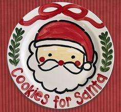 a plate with a santa clause on it and the words cookies for santa written in red