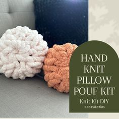 two knitted balls sitting on top of a couch next to the words hand knit pillow pouf kit