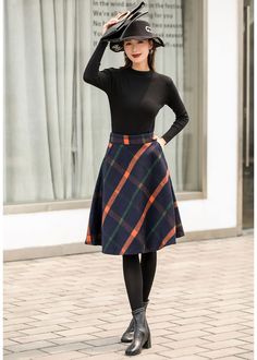 "This winter wool skirt is a classic piece of tailoring that will see you through rain or shine. It is cut with a flattering flared skirt to give you a wonderful shape. The winter skirt is perfect classic styling. This is a versatile skirt that you'll wear again and again. DETAILS: * 30% wool, 30% fiber, 40% polyester * fully satiny liner * Two side pockets * Right zip closure * A letter Back elastic, comfortable wear * Plus size full skirt * Perfect for Winter, autumn * Learn More about the ite Circle Skirt Elastic Waist, Winter Wool Skirt, Warm Skirt, Midi Skirt Winter, Warm Skirts, Long Linen Skirt, Wool Midi Skirt, Chiffon White Dress, Plaid Wool Skirt