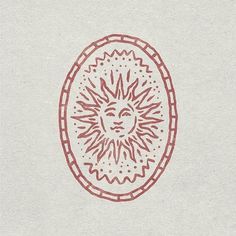 a drawing of a sun in the middle of a circle with red lines on it