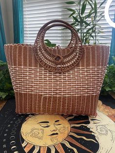 Beautiful large basket style handbag, it has a brown goldish color with white and the inside is very spacious. Brown Handheld Bucket Bag For Vacation, Brown Handheld Beach Bag For Summer, Handheld Brown Bucket Bag For Vacation, Light Brown Straw Tote Bag For Shopping, Summer Handheld Brown Straw Bag, Light Brown Shoulder Bag For The Beach, Bohemian Brown Straw Bag With Large Capacity, Light Brown Rectangular Straw Bag For Shopping, Light Brown Double Handle Straw Bag For Beach