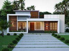 a modern house with steps leading up to the front door