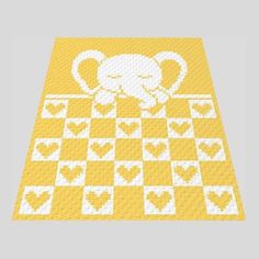 an elephant on a yellow and white checkerboard rug with hearts in the middle