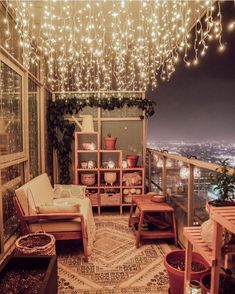 an image of a living room with lights hanging from the ceiling and furniture on the floor