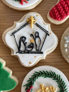 decorated cookies are displayed on a table