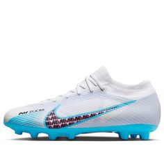 the nike vapor soccer shoe is white with blue accents and has a logo on it