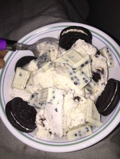 a bowl filled with ice cream and oreo cookies