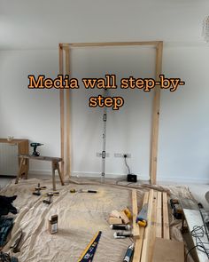 the room is being remodeled and ready to be used as a media wall step - by - step