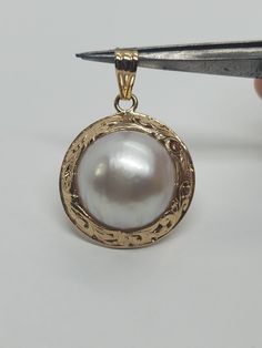 Your viewing a beautiful mabe pearl pendant. The pendant marked 14k and ming's. The pendant total weight approx. 6.47 grams. The pendant itself measures approx. 35mm x 23mm wide. Or 1 3/8 inches top to bottom . Beautiful mabe  pendant good pre owned condition. Double Dragon, Mabe Pearl, Dragon Head, Natural Jade, Pearl Pendant, Bracelet Gift, Beautiful Earrings, Pendant Necklaces, Solid Gold