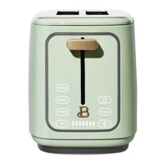 a green toaster sitting on top of a white counter