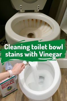 a person is cleaning a toilet bowl with borax and the words cleaning toilet bowl stains with borax