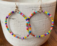 Gold filled beaded hoops. These hoops measure 2 inch in diameter. Adjustable Colorful Beaded Circle Hoop Earrings, Summer Hoop Earrings With Colorful Beads, Adjustable Hoop Earrings With Colorful Beads, Adjustable Hoop Beaded Earrings With Colorful Beads, Colorful Beaded Hoop Earrings For Summer, Adjustable Colorful Beaded Round Earrings, Summer Colorful Beaded Round Hoop Earrings, Hoop Beaded Earrings With Spacer Beads, Multicolor Hoop Beaded Earrings With Spacer Beads