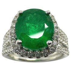 Elevate your jewelry collection with our 18k white gold Diamond and Emerald Ring. The sparkling 0.56 carat diamonds and vibrant 3.21 carat emerald are expertly crafted in a size 6.25 ring, weighing only 8.4 grams. Make a statement with this luxurious and timeless piece. 18k White Gold Diamond and Emerald Ring Condition: In good condition with some minor surface wear consistent with age. Ring size: 6.25 Markings: "T864" "750" Metal: 18k White Gold Weight: 8.40 grams Diamonds: 0.56 carats  Emerald: 3.21 carats Diamond And Emerald Ring, Modern Engagement Rings, Bracelet Love, Gio Ponti, Modern Ring, Love Ring, Baccarat, Gold Jewelry Fashion, Emerald Ring