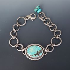 Handmade sterling silver bracelet for women featuring a beautiful turquoise. I am particularly proud of the heirloom quality of my jewelry. Each piece is meticulously hand crafted and made with endurance in mind. This bracelet has an antiqued satin finish. Shipping: This bracelet is finished and ready to ship in 1-2 business days. All jewelry is packed in a gift box. Gift wrapping available upon request. Measurements: Length 7.5 - 8.5 inches (19-21.6cm). The length can be adjusted per your reque Turquoise And Silver Jewelry, Artisan Turquoise Sterling Silver Bracelet, Handmade Turquoise Oval Sterling Silver Bracelet, Handmade Turquoise Sterling Silver Oval Bracelet, Handmade Oval Turquoise Sterling Silver Bracelet, Turquoise Silver Bracelet, Silver Bracelet For Women, Silver Link Bracelet, Soldering Jewelry