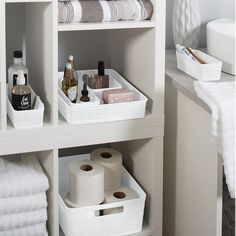 the bathroom is clean and ready to be used as a storage area for toiletries