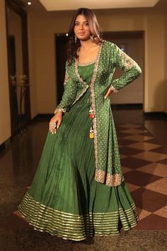 Green silk Anarkali featuring floral embroidery and gota patti work. Paired with a matching tie-up jacket adorned with bandhani print and pearl tassel details., Fit: Relaxed Indowestern Bandhani Outfits, Bandhini Dress Patterns, Bandhani Dress Pattern, Floral Anarkali, Bandhani Print, Gota Patti Work, Bandhani Dress, Silk Anarkali, Scallop Border