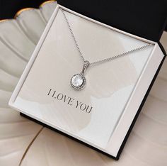 Surprise your loved one with a timeless and elegant gift. Our dazzling Eternal Hope Necklace features a cushion cut center cubic zirconia that will sparkle with every step. The center crystal is adorned with equally brilliant CZ crystals, ensuring a stunning look every wear. Wow her by gifting her an accessory that will pair with everything in her wardrobe! 14k white gold finish over stainless steel 8mm cushion-cut center cubic zirconia crystal 1.2mm accent CZ crystals Pendant dimensions: 0.6" (14mm) height / 0.5" (11.6mm) width Adjustable box chain length: 16" - 18" (40.64- 45.72cm) Lobster clasp Your piece is lovingly packaged in a complimentary soft touch box for easy gifting. Elevate your presentation by upgrading to the mahogany style luxury box, which features a brilliant LED spotlig Crystals Pendant, Hope Necklace, Birthday Special, First Mothers Day, Luxury Boxes, My Girlfriend, Eternal Love, Gift For Wife, Box Chain