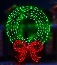 LED wreath wire decoration. Pre-lit with green and red lights. Green Christmas Lights, Outdoor Christmas Wreaths, Wreath With Bow, Lighted Wreaths, Christmas Wreaths With Lights, Outside Christmas Decorations, Led Rope Lights, Door Wreaths Diy, Outdoor Wreaths