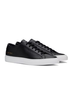 Common Projects: Black Original Achilles Low Sneakers | SSENSE Modern Black Custom Sneakers In Calf Leather, Modern Black Custom Calf Leather Sneakers, Black Modern Custom Calf Leather Sneakers, Modern Black Calf Leather Custom Sneakers, Modern Black Custom Sneakers With Stitched Sole, Black Calf Leather High-top Sneakers For Streetwear, Classic Black Calf Leather Sneakers, Custom Black Leather Sneakers With Rubber Heel Cap, Black Sneakers With Vulcanized Sole In Calf Leather