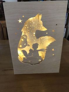 a card with the silhouette of a girl and a bear on it, surrounded by stars