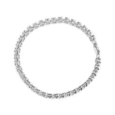 Disfrute del lujoso brillo de los diamantes con esta impresionante pulsera de tenis de plata esterlina. Elaborada por expertos en plata de ley .925, esta pulsera presenta 10 diamantes naturales de talla redonda en un brillante engaste milagroso. Los diamantes cuentan con un cálido color IJ y una claridad de I2-I3, creando un impresionante contraste con la reluciente banda plateada. El brazalete de 7,25 pulgadas cuenta con un cierre de caja seguro, lo que lo convierte en un accesorio cómodo y práctico para el uso diario. Perfecta para realzar su apariencia diaria o hacer una declaración elegante en un evento especial, esta pulsera de tenis de plata esterlina con diamantes es una adición imprescindible a su colección de joyas. Deje que los diamantes relucientes sean un recordatorio de su bel Evening Gala, Bracelet Tennis, Elegant Dinner, Anniversary Celebration, Tennis Bracelet, Round Cut Diamond, Silver Band, Formal Event, Tennis