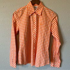 Lily Pulitzer Button Down Blouse Checkered Pattern Long Sleeve Size: 4 Color: Orange And White Condition: Previously Owned And In Excellent Condition. Looks Brand New & Like It Hasn’t Been Worn. Typically Can Ship The Next Day Offers Welcomed Smoke Free/Pet Free Home Bundle And Save Please Feel Free To Ask Questions Thank You For Stopping By My Closet! Happy Poshing! Gingham Button-up Top With Button Closure, Classic Orange Tops For Spring, Orange Cotton Blouse With Button Closure, Spring Gingham Button-up Blouse, Spring Button-up Gingham Blouse, Gingham Button-up Blouse With Button Closure, Preppy Blouse With Button Closure, Classic Fitted Orange Shirt, Spring Orange Shirt With Button Closure