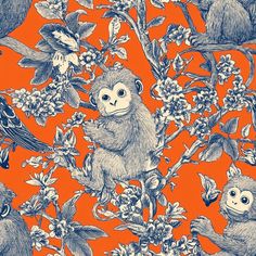 an orange background with monkeys and flowers