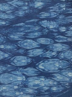 an image of water ripples on the surface of the ocean with blue hues