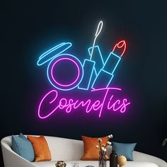 a neon sign that reads, oh cosmetos on the side of a wall